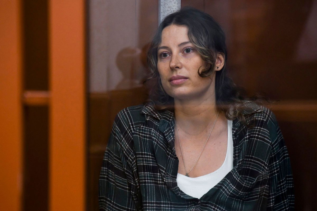 <i>AP via CNN Newsource</i><br/>Ksenia Karelina sits in a glass cage in a court in Yekaterinburg