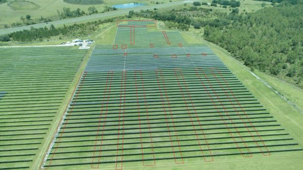 <i>US Department of Justice via CNN Newsource</i><br/>Aerial photo of the solar panel field Hnaihen allegedly attacked with targeted panel areas outlined in red.