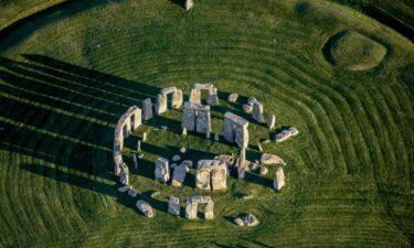 An aerial photograph showcases the Neolithic monument Stonehenge on the Salisburty Plain in England.