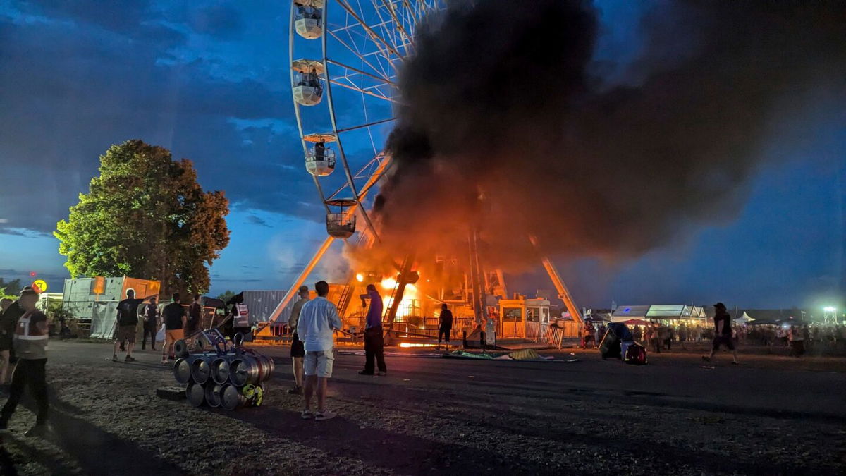 <i>Picture Alliance/DPA/AP via CNN Newsource</i><br/>Images showed the Ferris wheel on fire with smoke billowing from the ride.