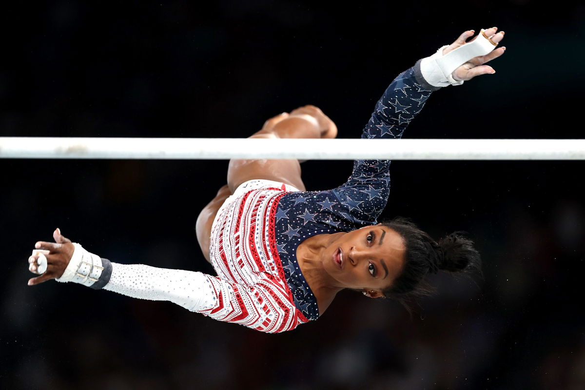 <i>Jamie Squire/Getty Images via CNN Newsource</i><br/>Simone Biles competes on the uneven bars in the women's team final at the Paris Olympics.