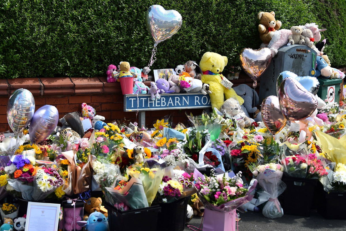 <i>Peter Powell/AFP/Getty Images via CNN Newsource</i><br/>Floral tributes are left for the victims of a deadly knife attack in Southport