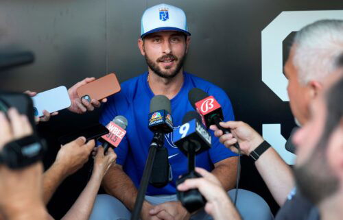 The Kansas City Royals' Paul DeJong talks to reporters shortly after being traded to the team from the Chicago White Sox.