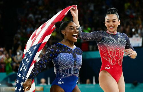 US gymnasts Simone Biles and Sunisa Lee celebrate their gold and bronze medals