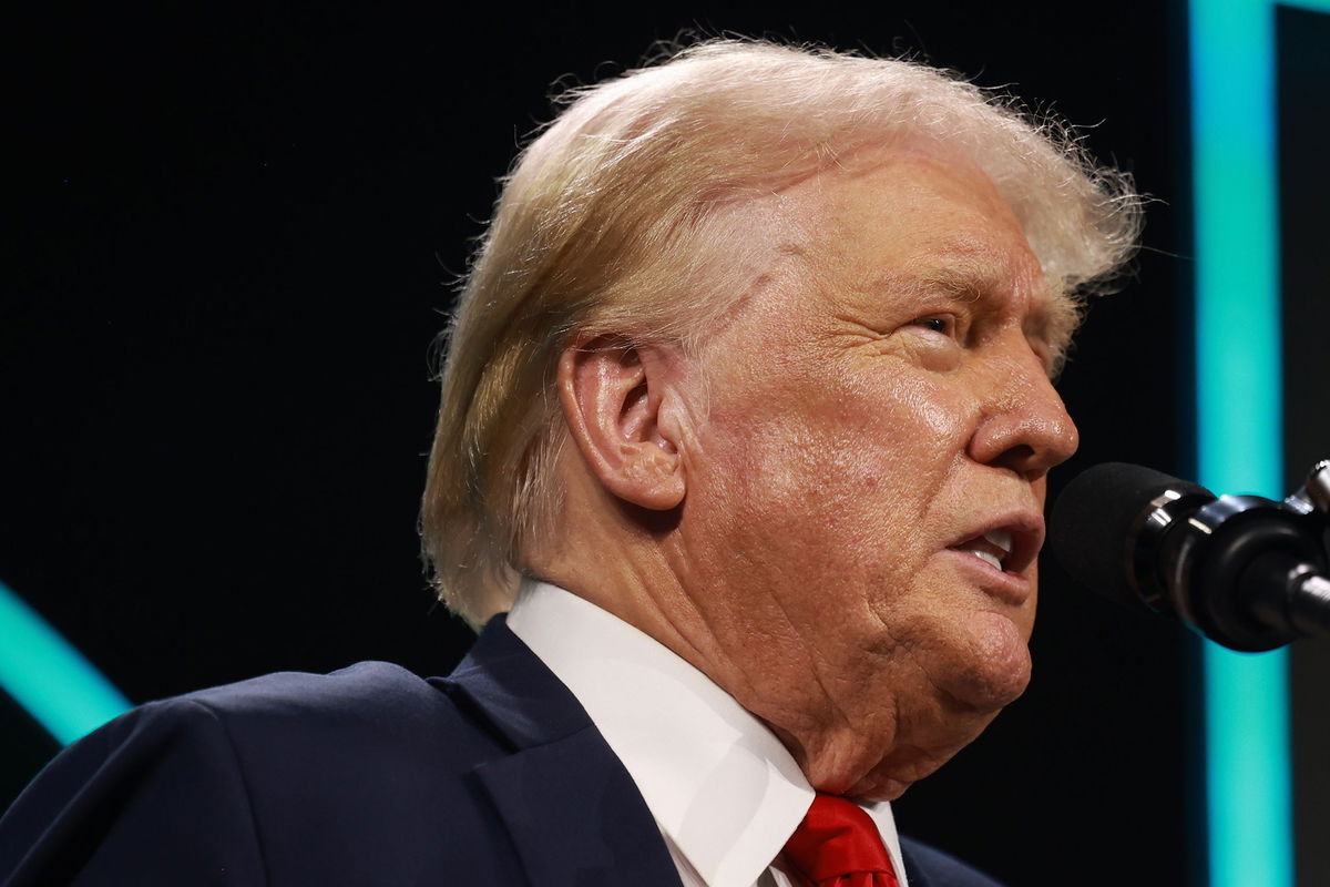 <i>Joe Raedle/Getty Images via CNN Newsource</i><br/>Former President Donald Trump speaks during a Turning Point USA Believers Summit conference at the Palm Beach Convention Center on July 26