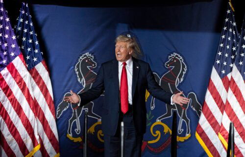 Former President Donald Trump arrives to speak at a campaign rally in Harrisburg