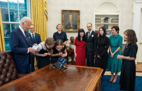 This photo posted to X.com by US President Joe Biden shows Biden and the families of detainees released as part of a complex prisoner swap between Russia on the phone for the first time since they were released in the White House in Washington