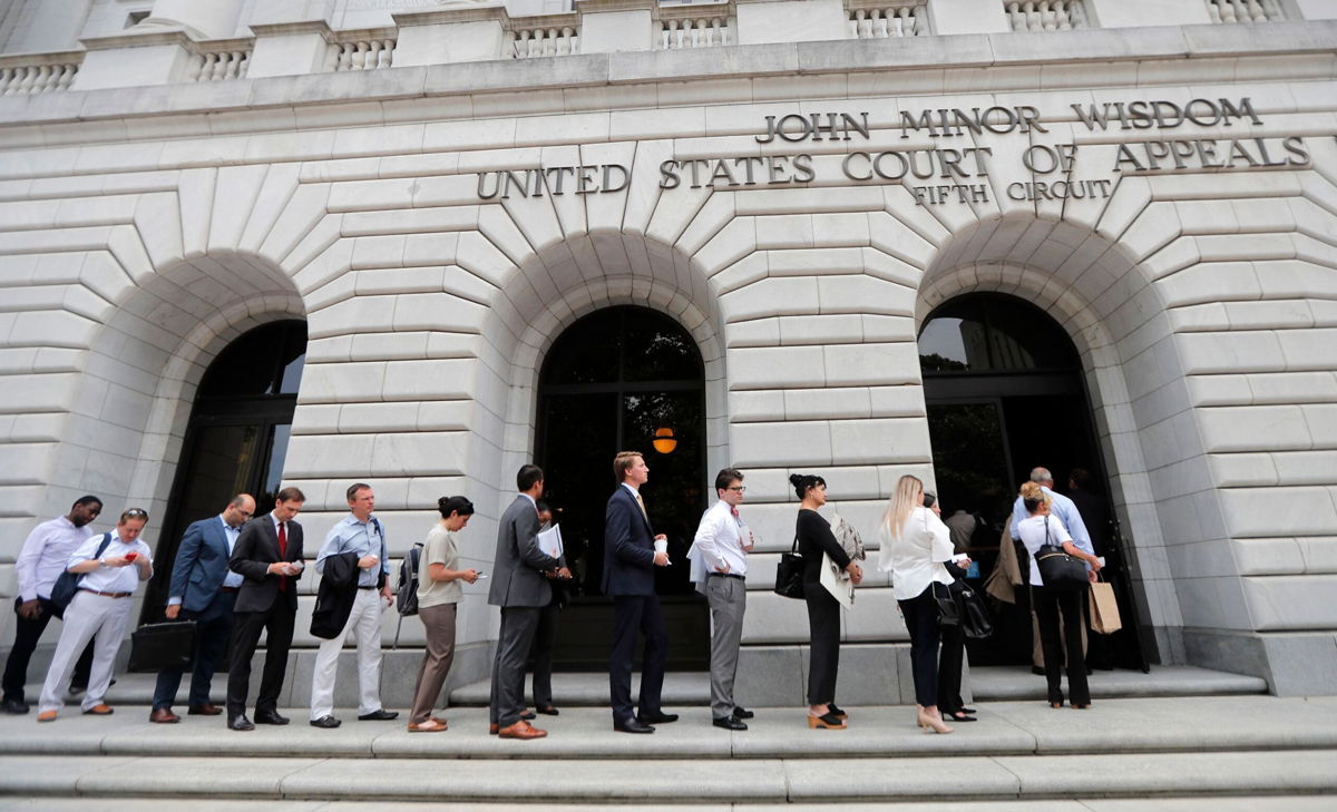<i>Gerald Herbert/AP via CNN Newsource</i><br/>People wait in line to enter the 5th Circuit Court of Appeals in New Orleans in Jan. 2019.