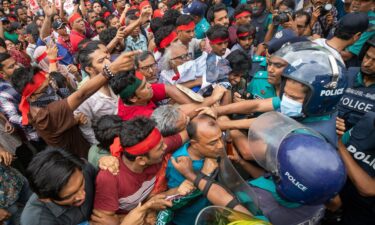 Activists clash with police during a protest in Dhaka