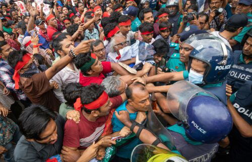 Activists clash with police during a protest in Dhaka