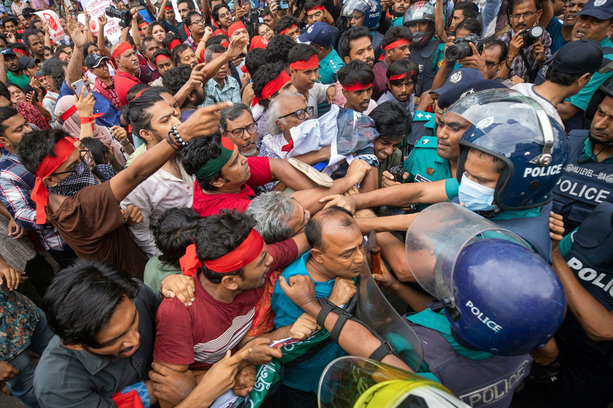 <i>Rajib Dhar/AP via CNN Newsource</i><br/>Activists clash with police during a protest in Dhaka