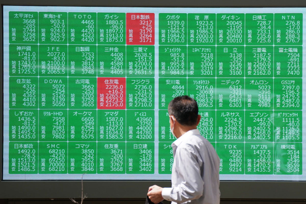 <i>Kazuhiro Nogi/AFP/Getty Images via CNN Newsource</i><br/>A man looks at an electronic board displaying stock prices in Tokyo on August 2.