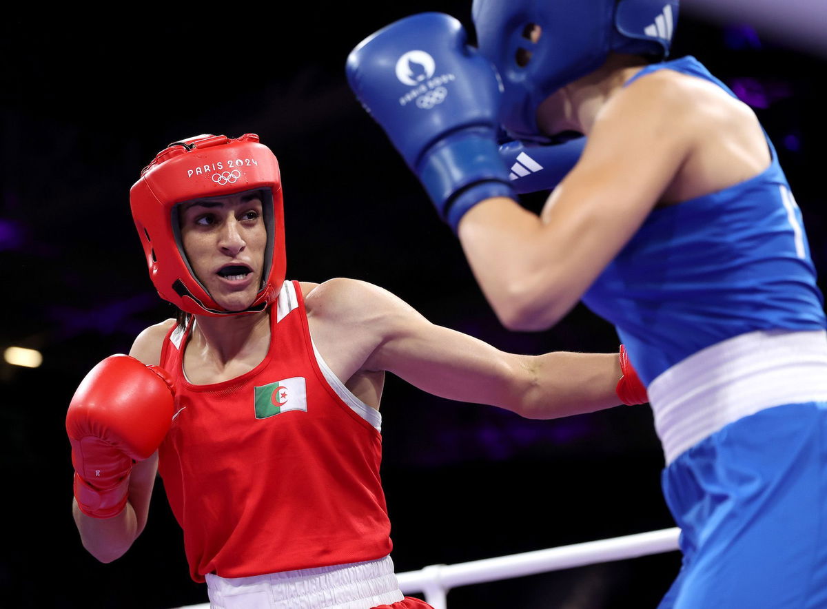 <i>Richard Pelham/Getty Images via CNN Newsource</i><br/>Algeria's Imane Khelif punches Italy's Angela Carini during the Women's 66kg preliminary round match of the Paris Olympics on August 2.