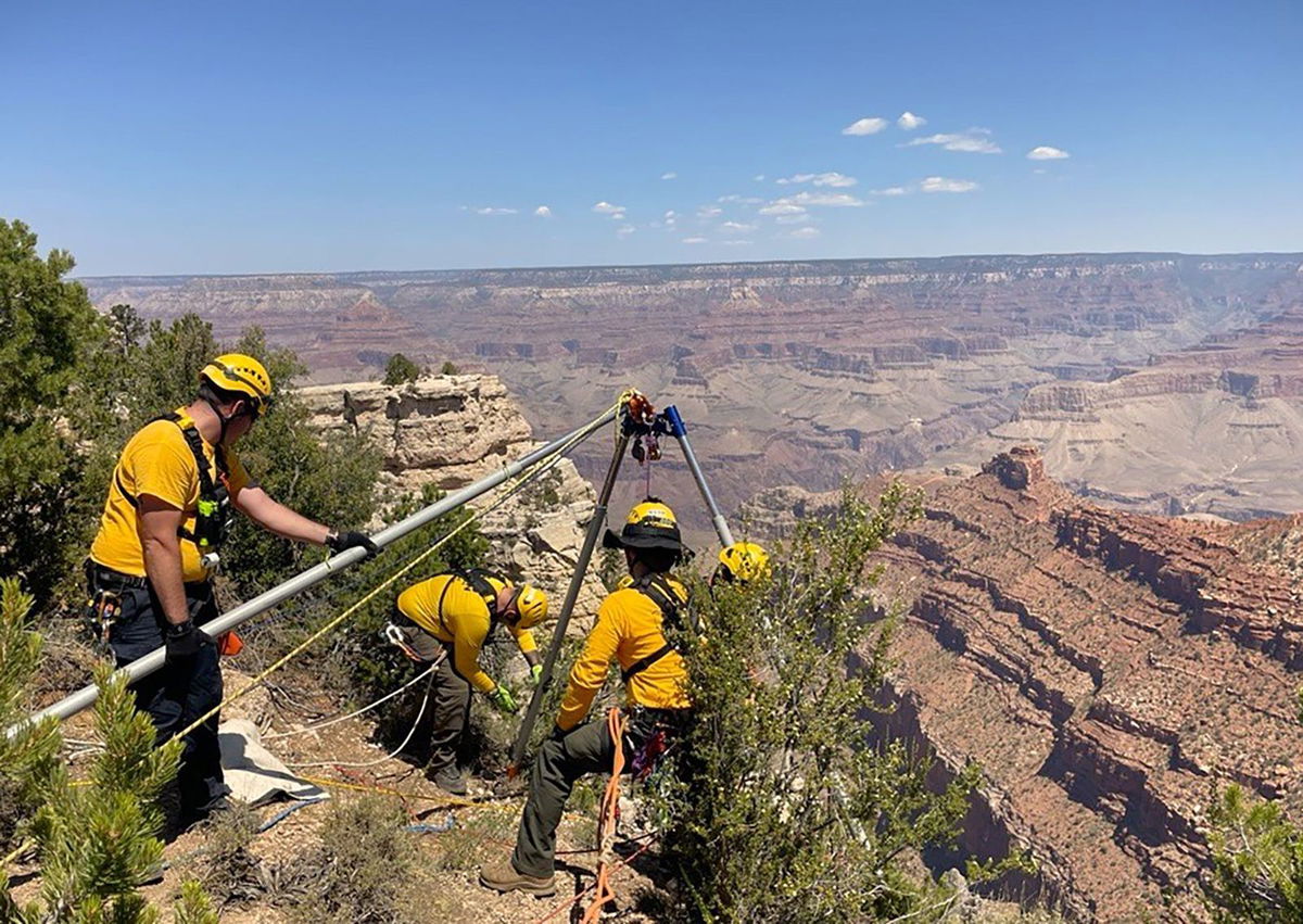 <i>K.Ross/NPS via CNN Newsource</i><br/>Responders manage a high angle technical rescue system on July 31