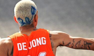 Olympic basketball player Worthy de Jong of Team Netherlands decided to switch up his look with a blue dyed flower painted across his bleached buzz cut.