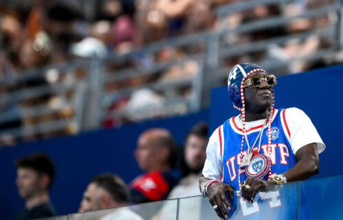 Flavor Flav watches the women's water polo match between team Italy team USA at the Paris Olympics on July 31.