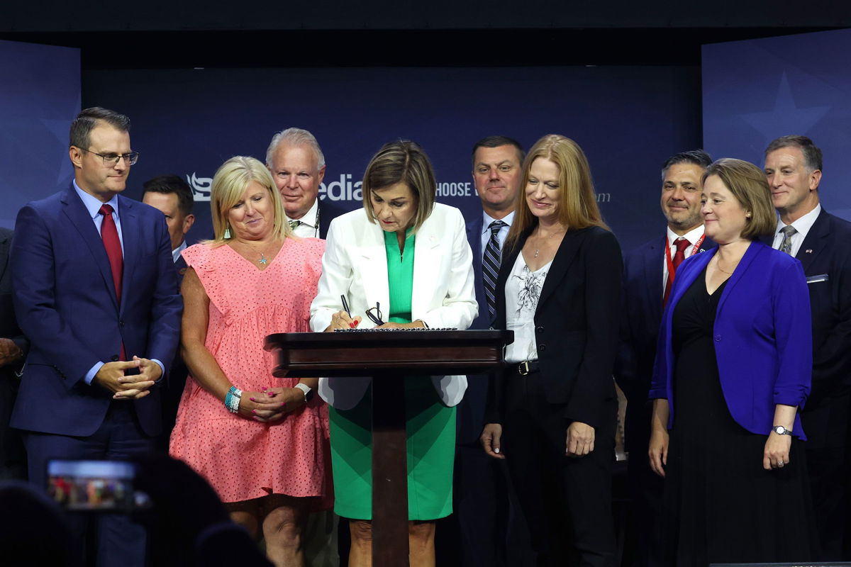 <i>Scott Olson/Getty Images via CNN Newsource</i><br/>Iowa Gov. Kim Reynolds signs into law a bill that bans most abortions after around six weeks of pregnancy on July 14
