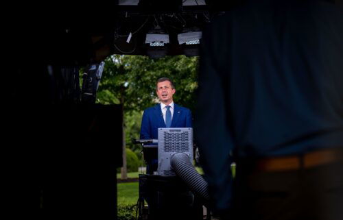 Transportation Secretary Pete Buttigieg speaks during an interview on the North Lawn of the White House in Washington