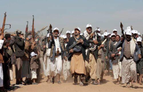 Houthi fighters march during a rally outside Sanaa