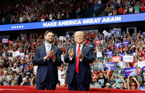 Former President Donald Trump stands onstage with his running mate