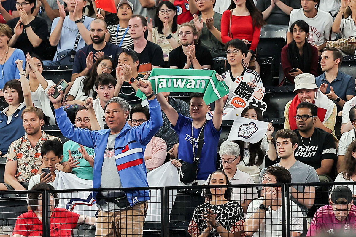 <i>Ann Wang/Reuters via CNN Newsource</i><br/>Journalists reported seeing a man holding a green Taiwan banner being removed from an Olympic badminton game mid-match.