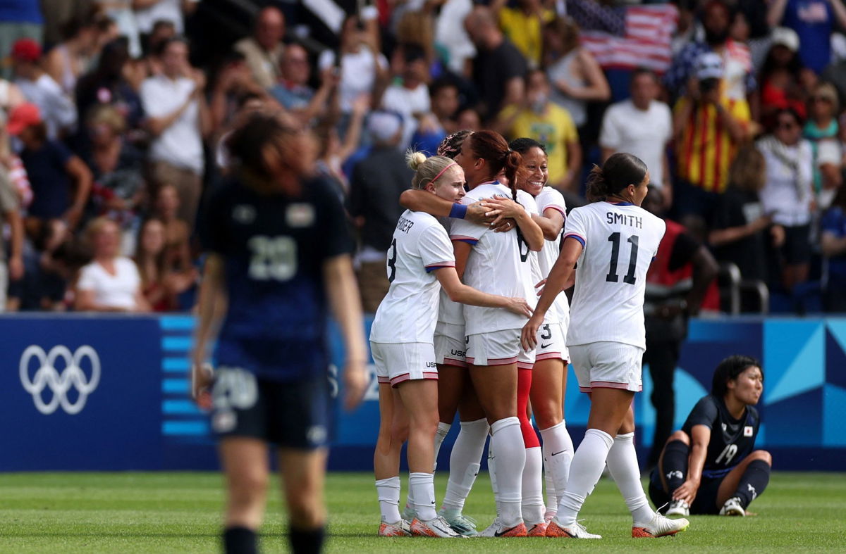 <i>Paul Childs/Reuters via CNN Newsource</i><br/>US players celebrate after beating Japan and advancing to the semifinal.