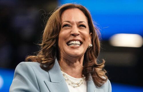 US Vice President and 2024 Democratic presidential candidate Kamala Harris smiles as she takes the podium to speak at a campaign rally in Atlanta