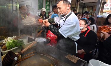 A staff member cooks Tianshui Spicy Hot Pot on March 14