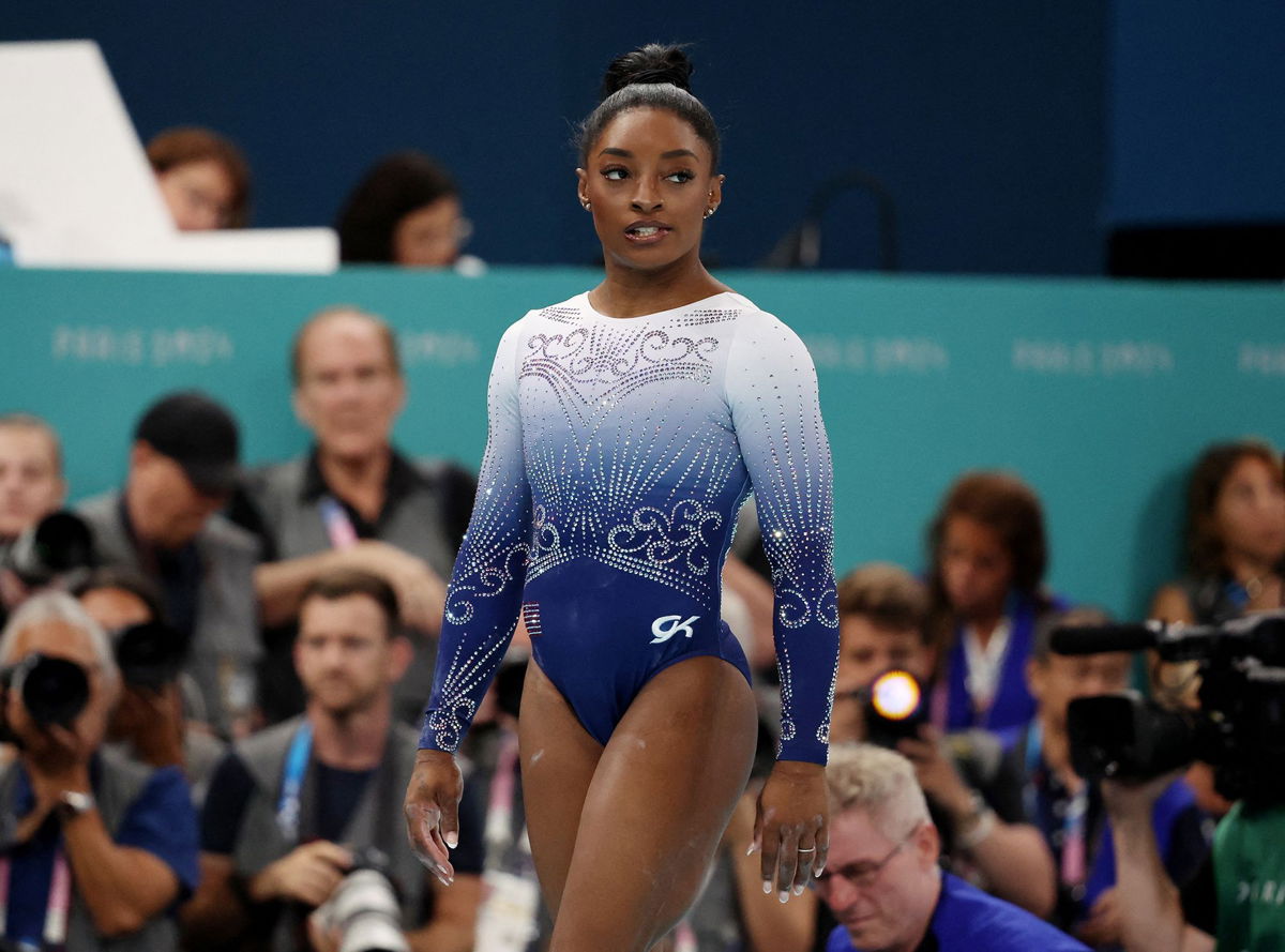 <i>Mike Blake/Reuters via CNN Newsource</i><br/>Simone Biles of United States reacts after falling off during her performance in the women's balance beam final on August 5.