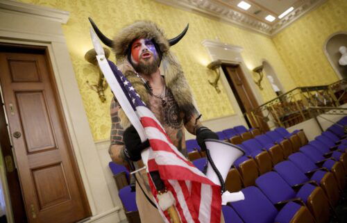 Jacob Chansley inside the Senate Chamber on January 06