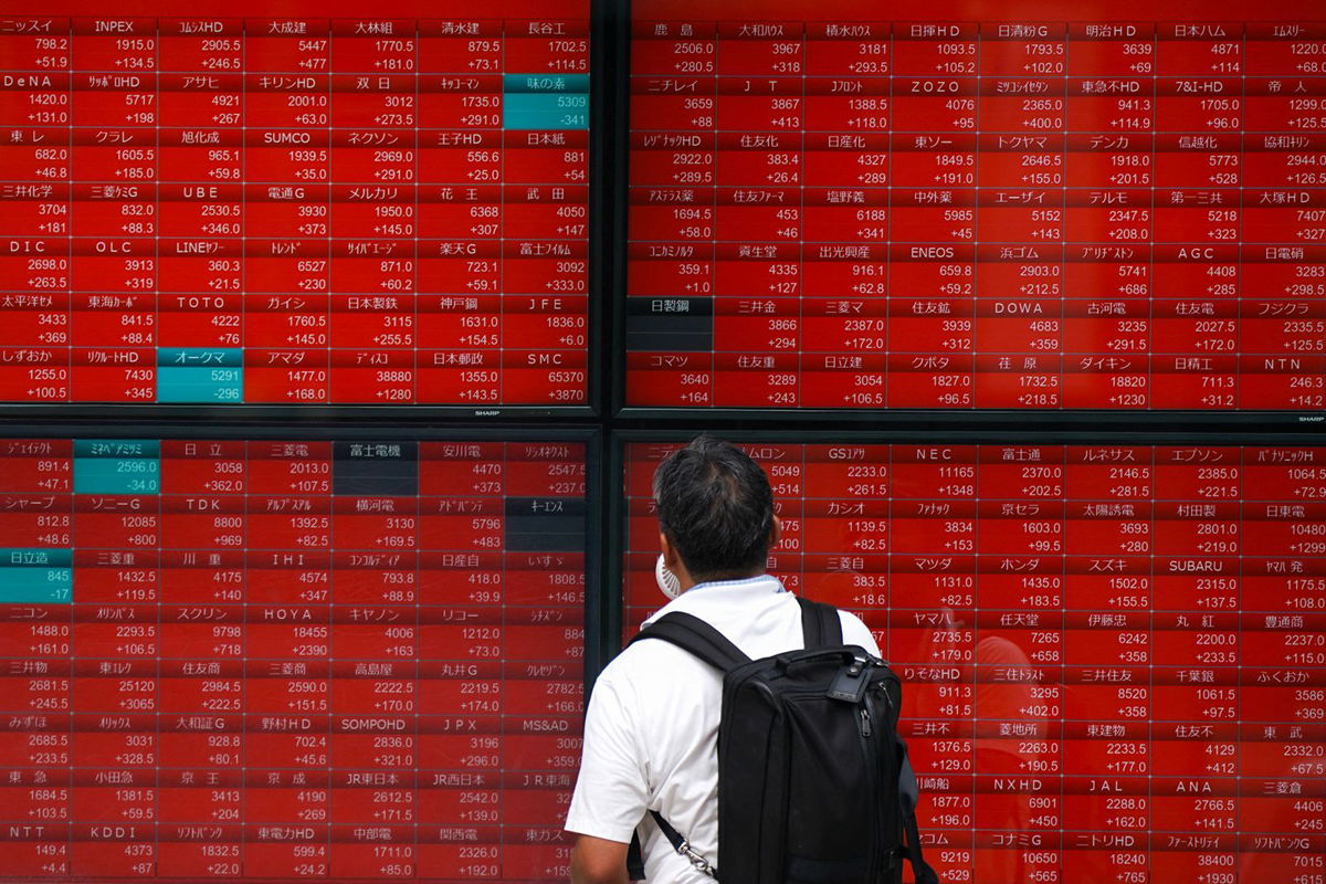 <i>Kazuhiro Nogi/AFP/Getty Images via CNN Newsource</i><br/>A man looks at an electronic quotation board displaying stock prices of the Nikkei 225 on the Tokyo Stock Exchange in Tokyo on August 6