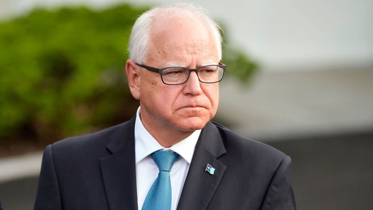 <i>Jacquelyn Martin/AP via CNN Newsource</i><br/>Minnesota Gov. Tim Walz listens as Maryland speaks to reporters after meeting with President Joe Biden