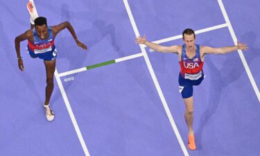 Hocker (right) and Nuguse cross the finish line of the men's 1