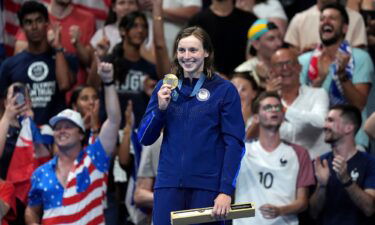 USA's Katie Ledecky poses with her gold medal after winning the women's 1500m freestyle final at the Paris La Defense Arena on the fifth day of the 2024 Paris Olympic Games in France on July 31.