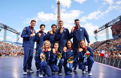 Members of the U.S. Olympic figure skating team celebrate with their gold medals from Beijing 2022.