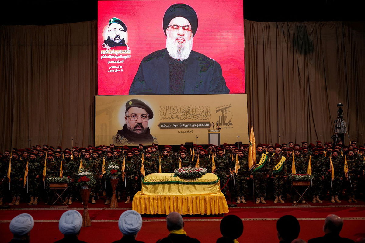 <i>Alkis Konstantinidis/Reuters via CNN Newsource</i><br/>Hezbollah leader Hassan Nasrallah appears on a screen as he addresses his supporters