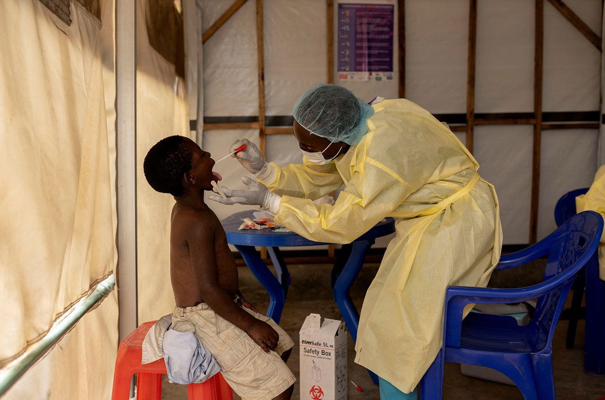 <i>Arlette Bashizi/Reuters/File via CNN Newsource</i><br/>A nurse takes a sample from a child suspected of having mpox at a treatment centre in Munigi