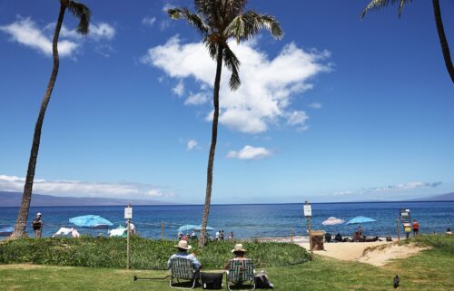 People gather along Kaanapali Beach on August 5