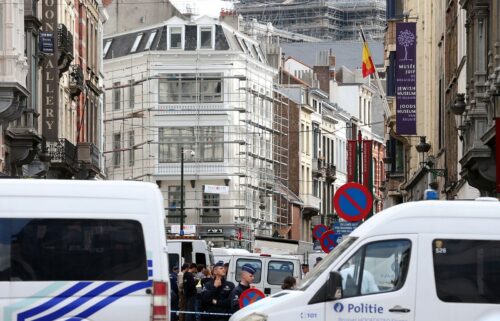 Policemen close the access of the scene of a shooting near the Jewish Museum in Brussels