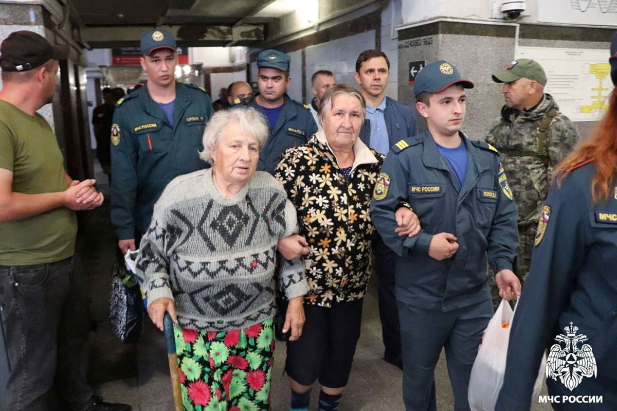 <i>Handout/Russian Emergencies Ministry/Reuters via CNN Newsource</i><br/>Russian authorities help residents during evacuation efforts at a railway station in Oryol