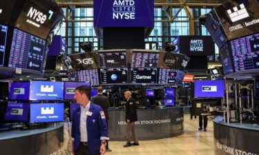 Traders work on the floor of the New York Stock Exchange (NYSE) ahead of the closing bell in New York City on August 5.