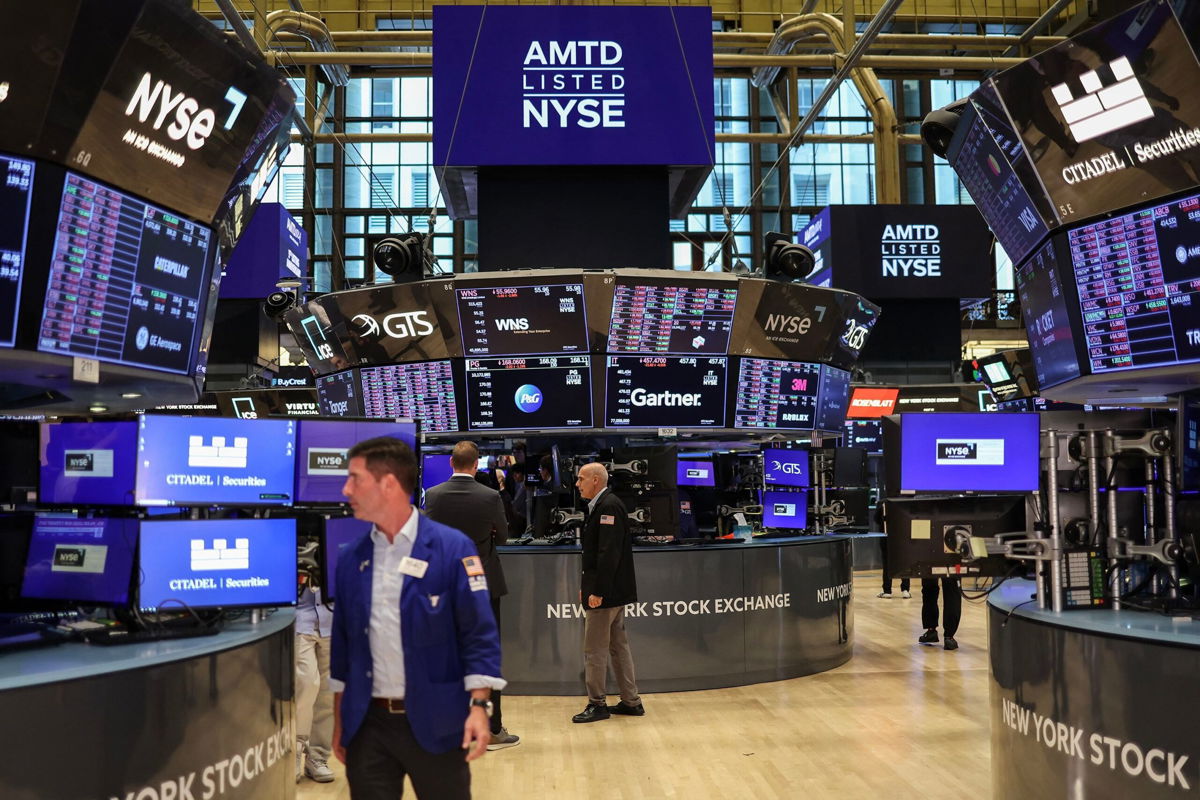 <i>Charly Triballeau/AFP/Getty Images via CNN Newsource</i><br/>Traders work on the floor of the New York Stock Exchange (NYSE) ahead of the closing bell in New York City on August 5.