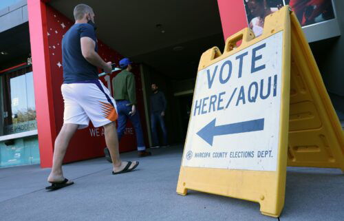 Voters arrive to cast their ballots at the Phoenix Art Museum on November 08