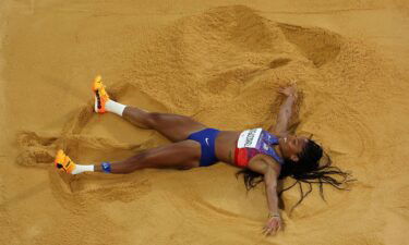 Davis-Woodhall celebrates winning the gold on August 8 in the Stade de France.