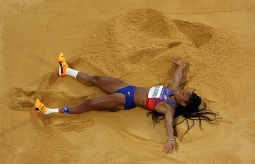 Davis-Woodhall celebrates winning the gold on August 8 in the Stade de France.