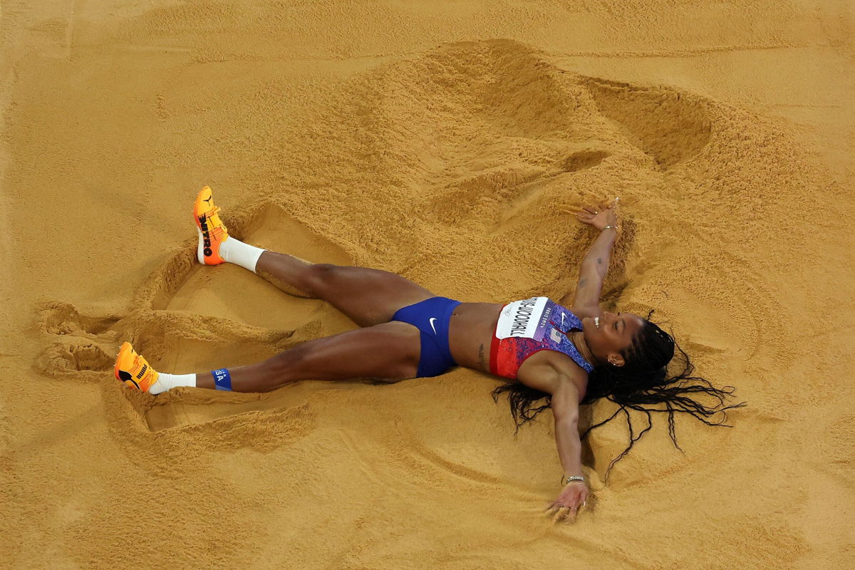 <i>Richard Heathcote/Getty Images via CNN Newsource</i><br/>Davis-Woodhall celebrates winning the gold on August 8 in the Stade de France.