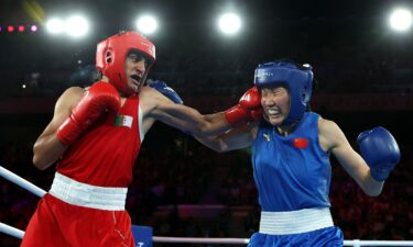 Imane Khelif (red) punches Yang Liu of China during the Women's 66kg boxing final.