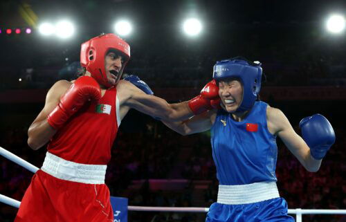 Imane Khelif (red) punches Yang Liu of China during the Women's 66kg boxing final.