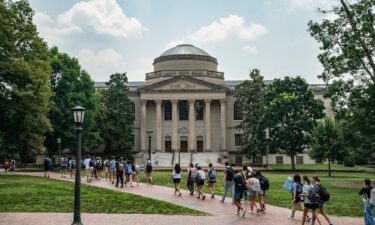 People walk on the campus of the University of North Carolina Chapel Hill in June 2023 in Chapel Hill