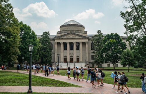 People walk on the campus of the University of North Carolina Chapel Hill in June 2023 in Chapel Hill